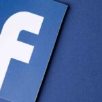 Facebook logo on blue paper background