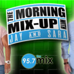 Two smiling radio hosts beside Morning Mix-Up logo