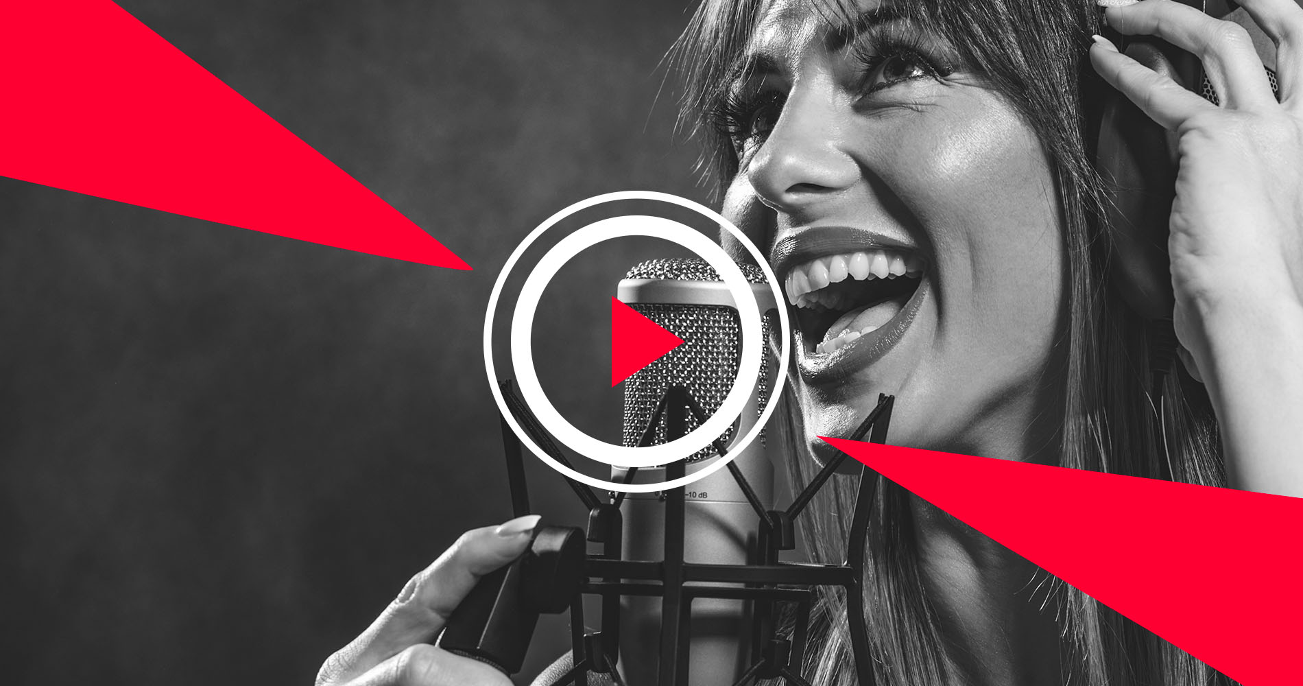 Female singer recording in studio with headphones